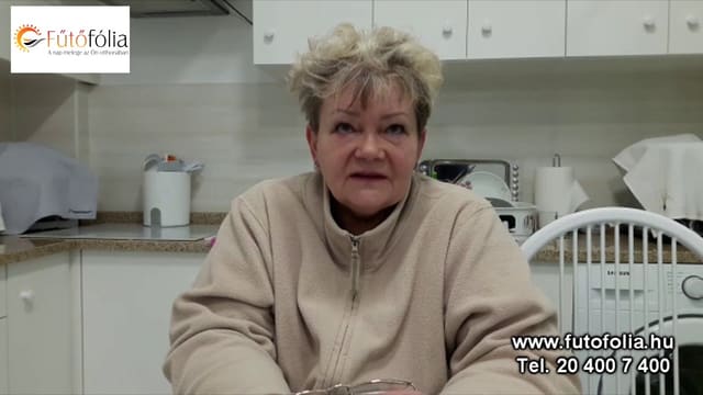 Erzsébet in the video talking about her one-year experience with heating film